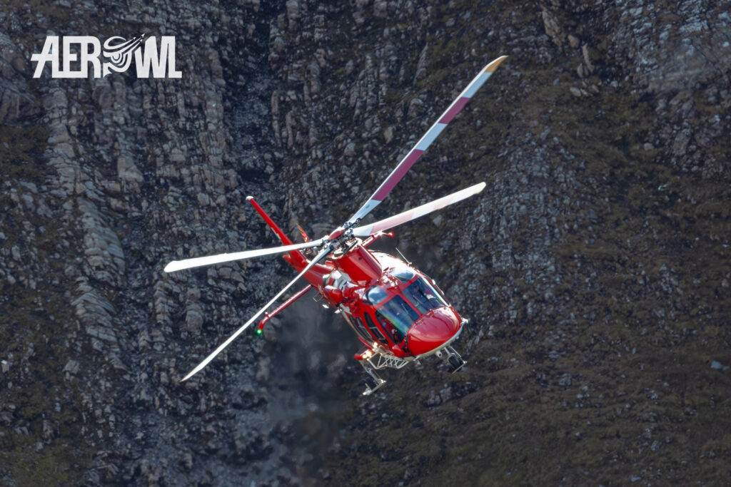 A Rega AgustaWestland Da Vinci helicopter in the Swiss Alps during Axalp 2023.