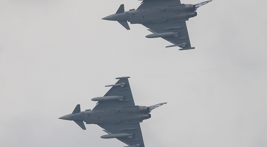 Two Eurofighter Typhoon of the Austrian Air Force turning during the airshow over the Hinterstoisser airbase at the AirPower24 in Zeltweg, Austria.