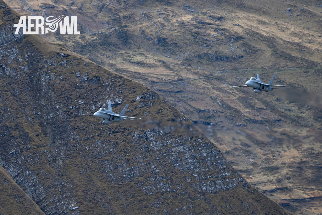 Two Swiss Air Force Boeing F/A-18C Hornets on their way to the Axalp 2023 air show in the Swiss Alps.