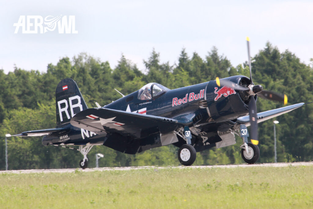 Rolling Red Bull Chance Vought F4U-4 "Corsair" during the ILA 2014 at the BER airport Berlin-Brandenburg in Germany.