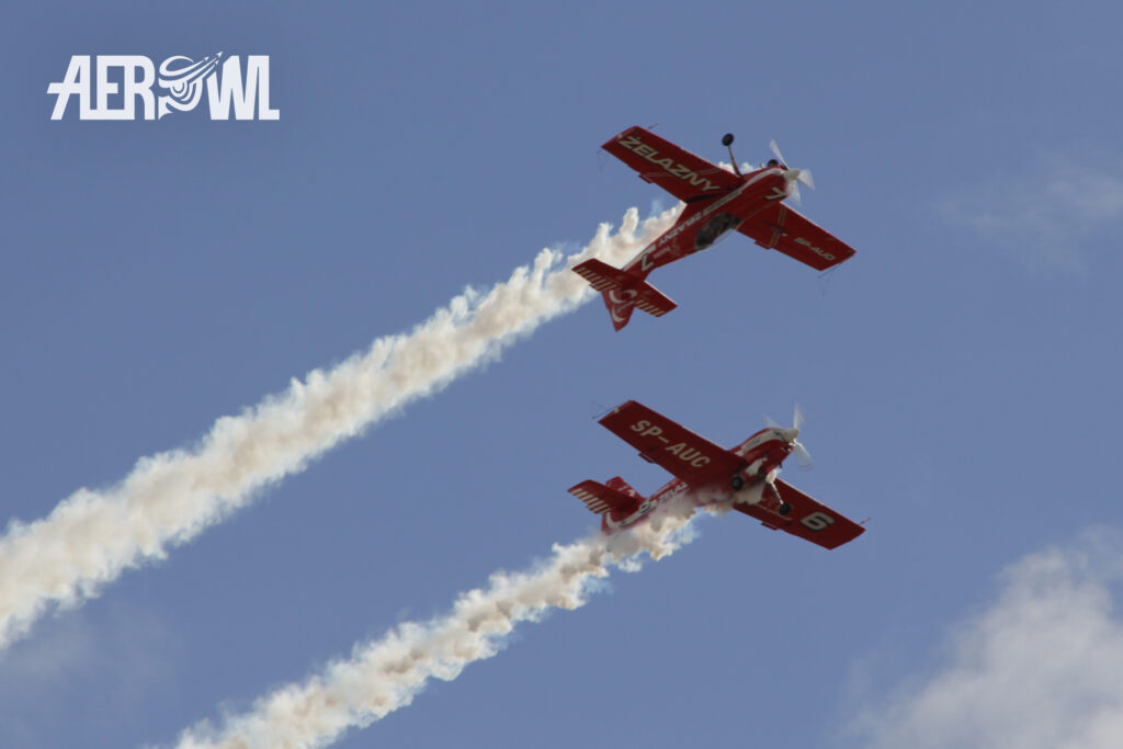 Grupa Akrobacyjna Żelazny in their Extra-330LC performing at the ILA 2014 over the runway of the BER airport in Berlin/Brandenburg, Germany.