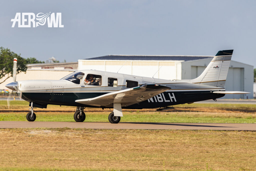 A Piper Saratoga II TC in white and black on its way to the runway at Sun'n Fun 2025 in Lakeland, Florida.