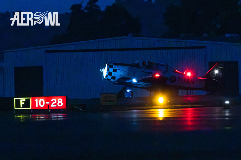 A North American AT-6 "Texan" of the Titan Aerobatic Team taxiing at night during the Sun´n Fun 2025 in Lakeland, Florida.